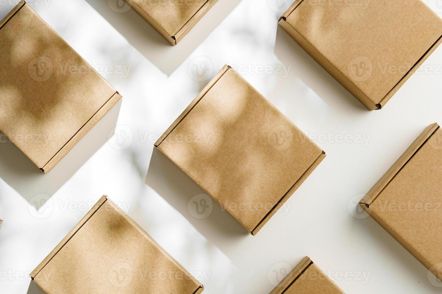 Brown cardboard boxes arranged on a light surface for packing goods in a warehouse setting photo