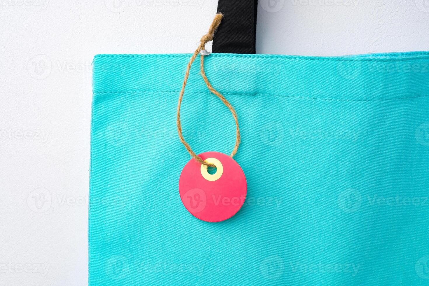 Eco bag for shopping with blank tag on white background photo