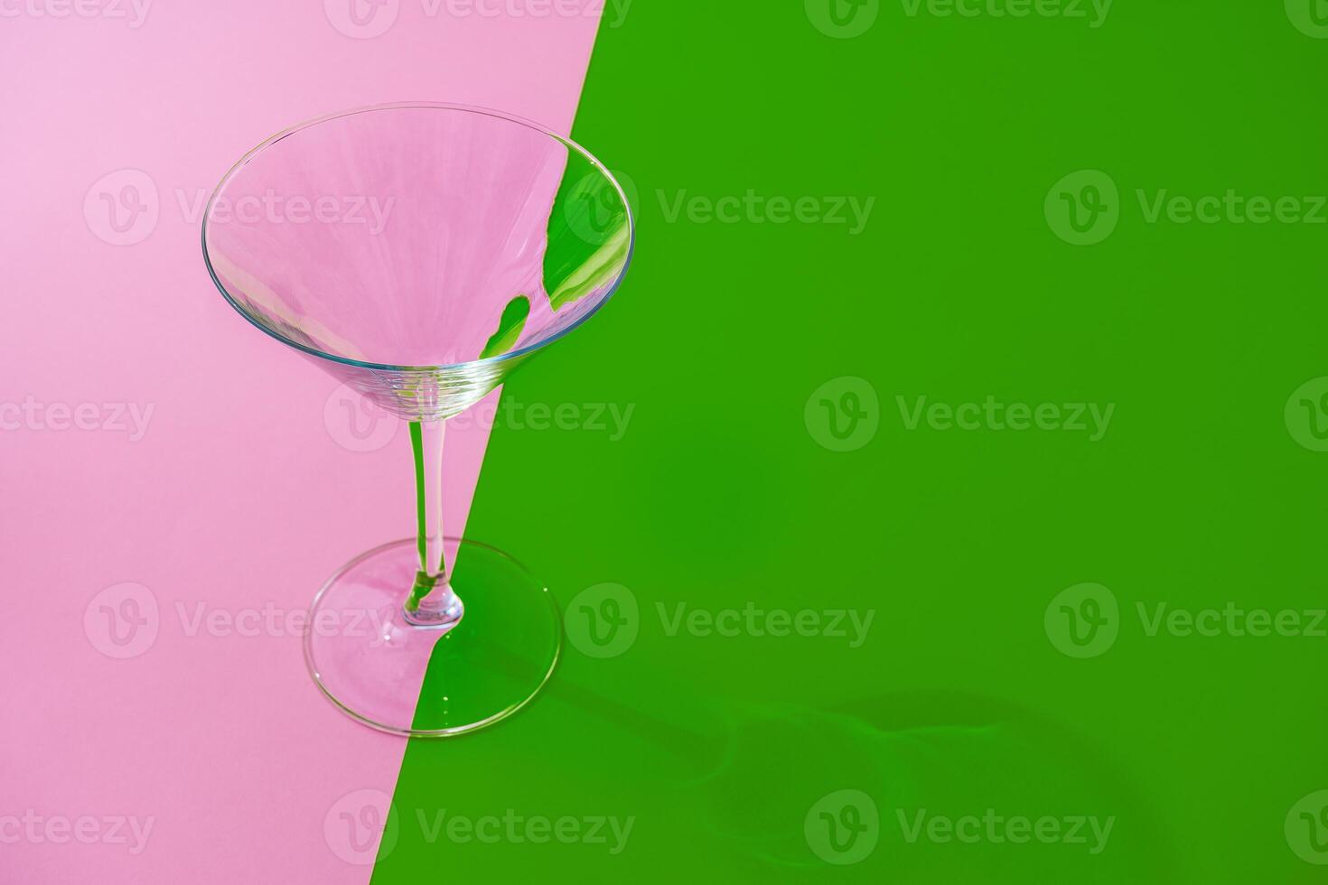 Empty transparent glass on a color background with copyspace. photo