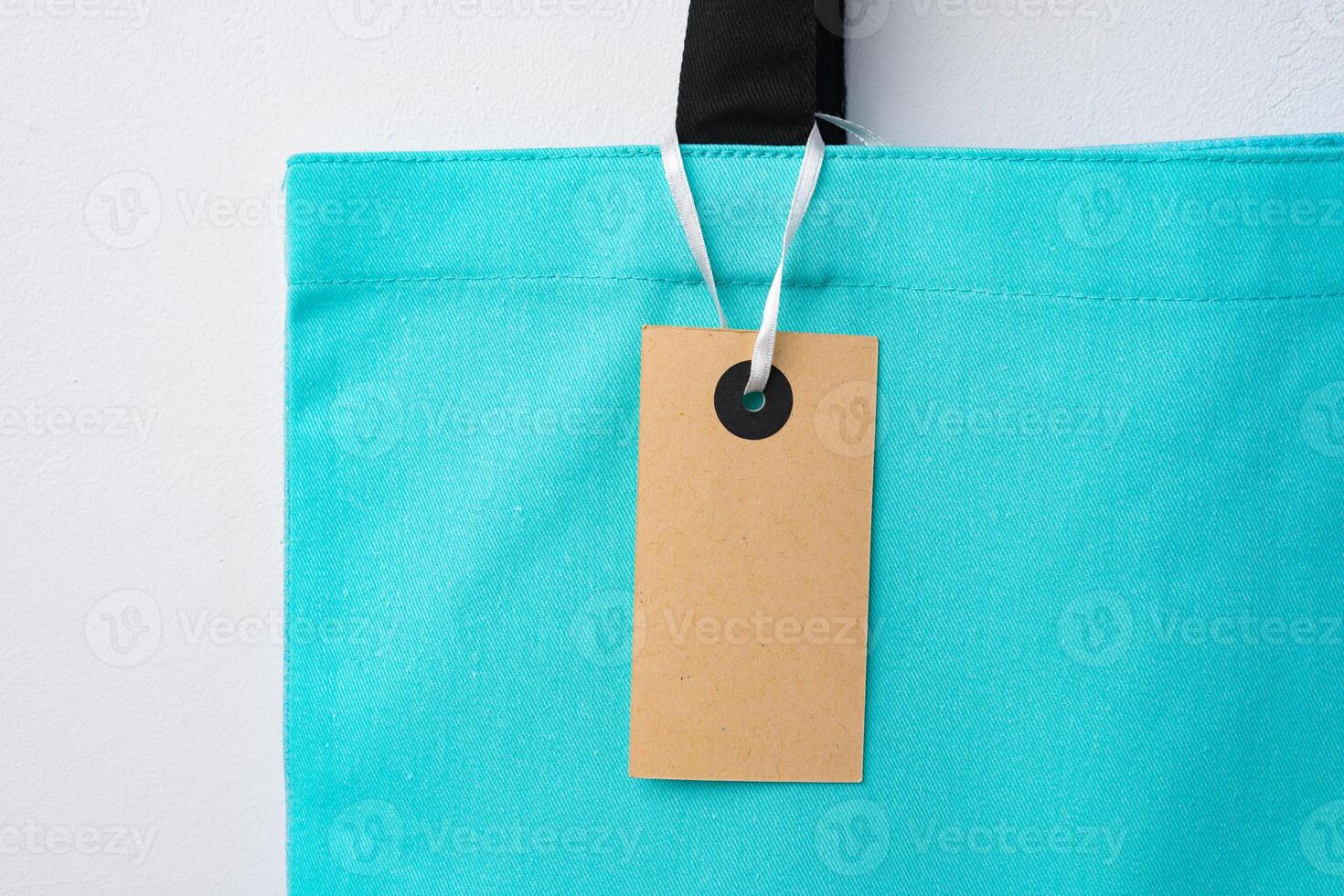 Eco bag for shopping with blank tag on white background photo