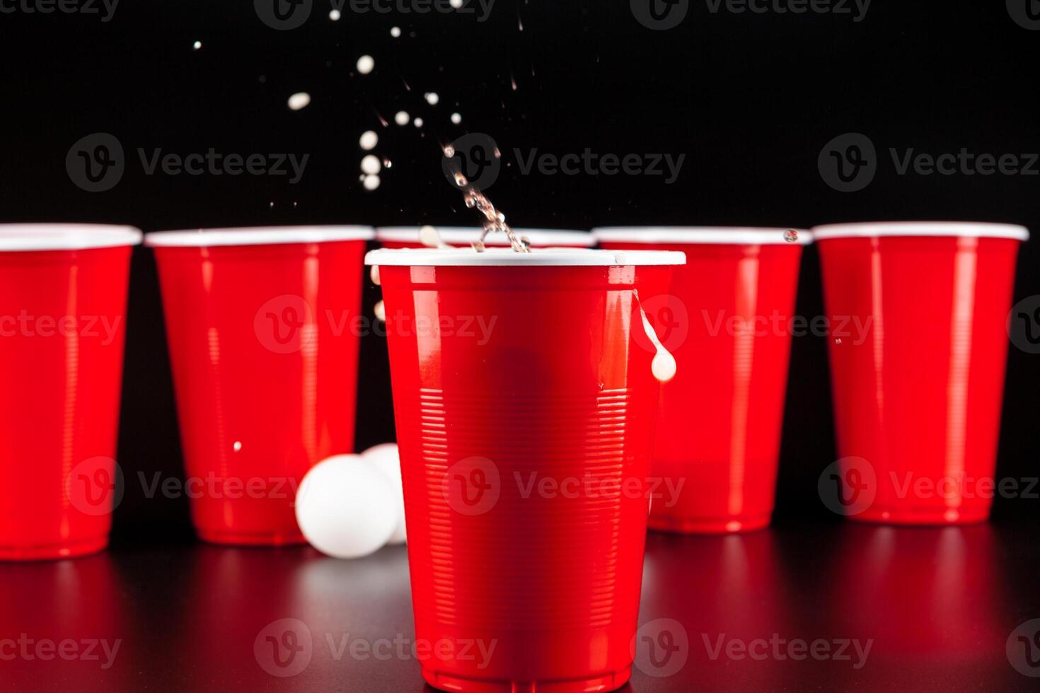 Cups for game Beer Pong on the table photo