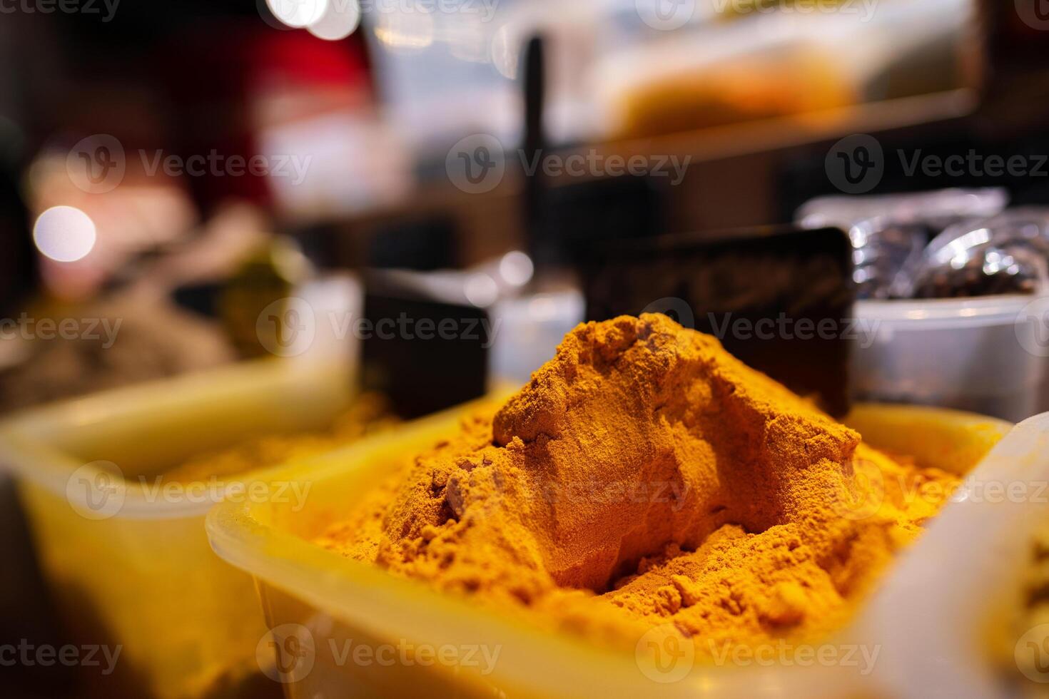 Colorful spices at a market for sale, close up photo