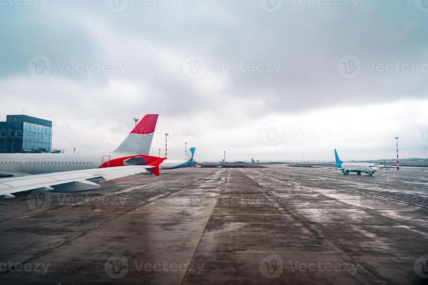 View of a passenger plane wing in airport photo