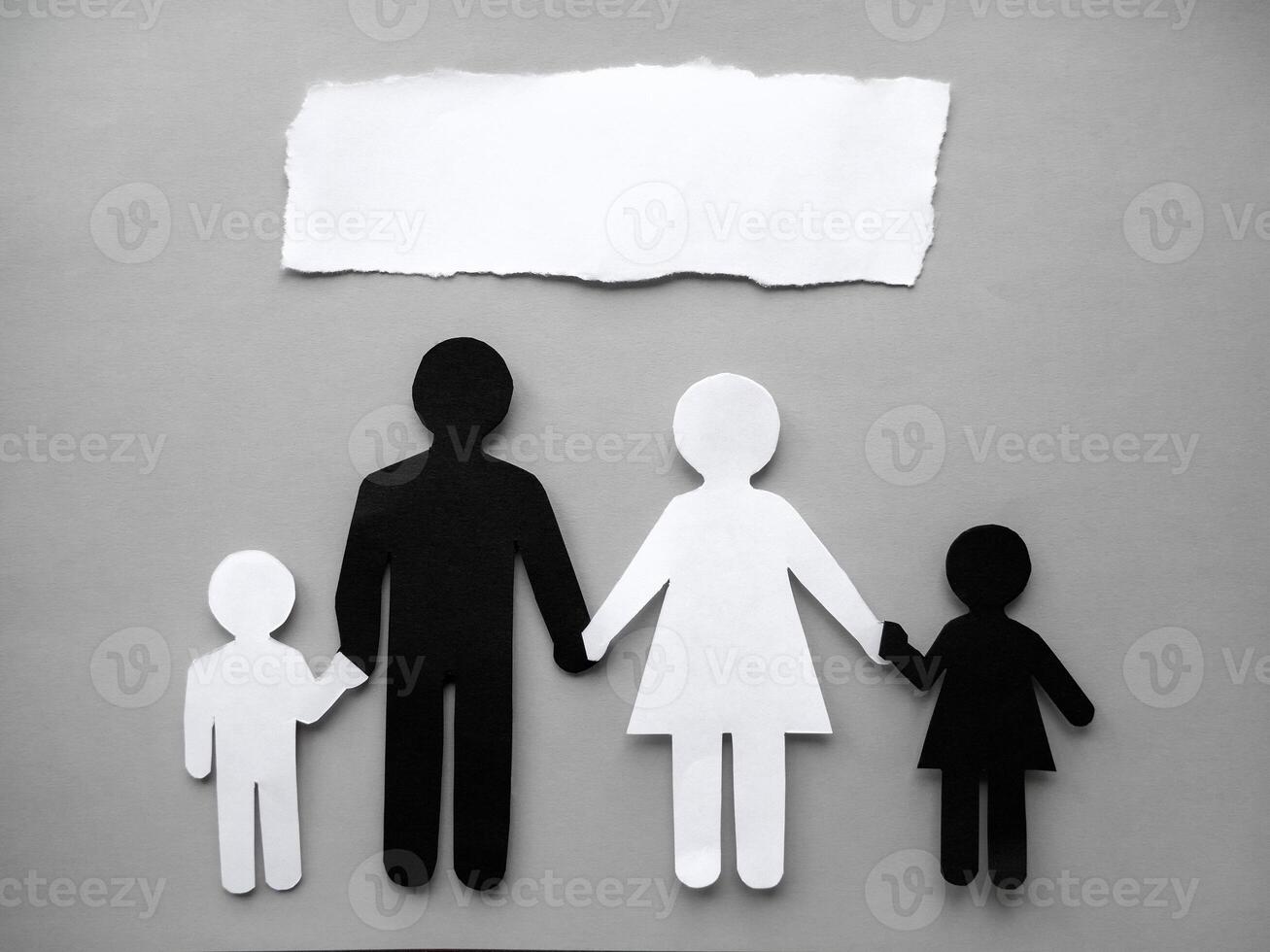 Symbol of a person and family cut out of black and white paper. Interracial family. Space for text. mixed race marriage photo