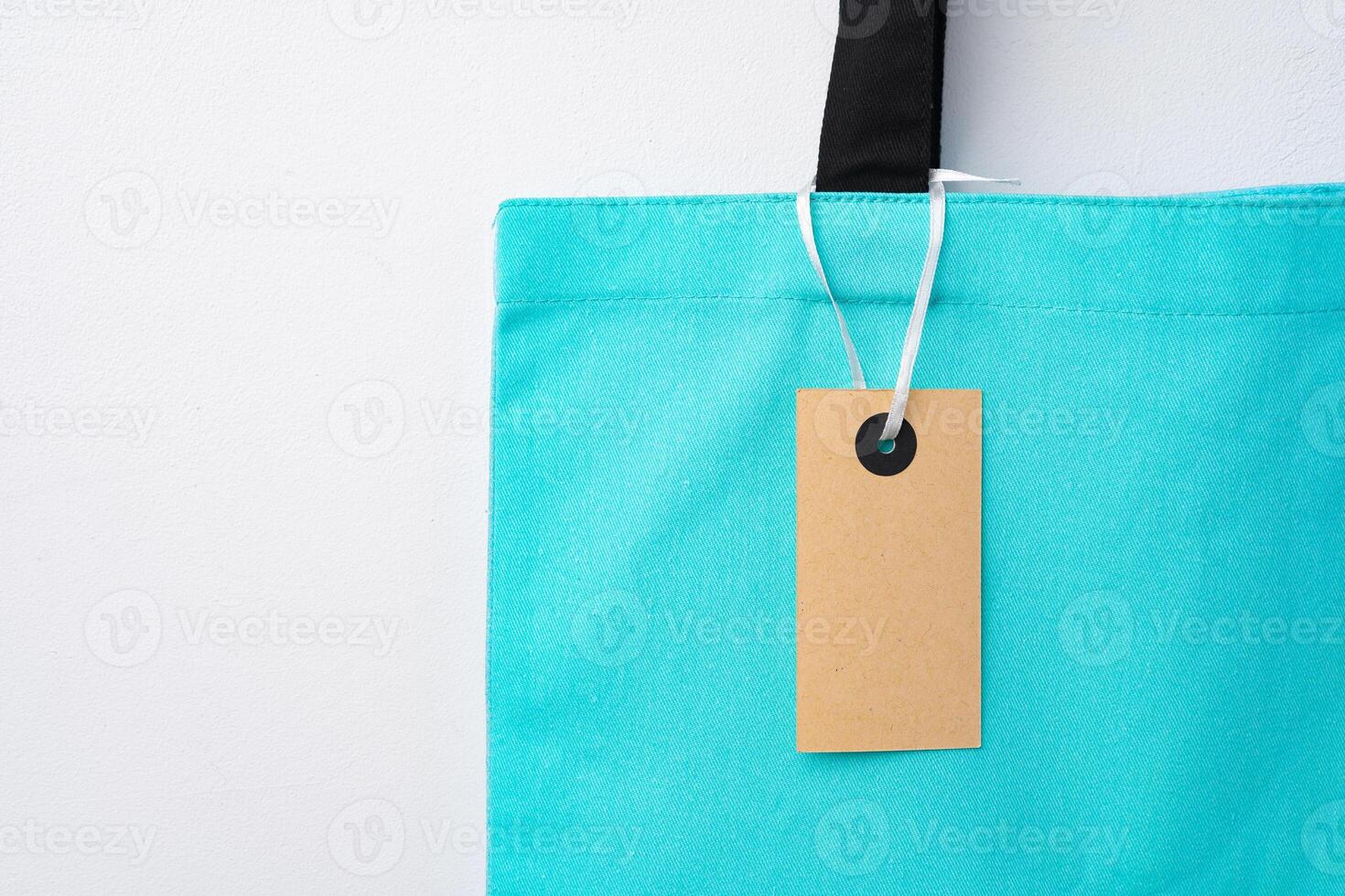 Eco bag for shopping with blank tag on white background photo
