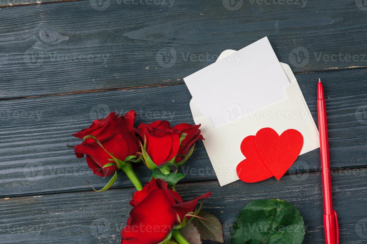 Red roses with message card. Valentines Day background photo