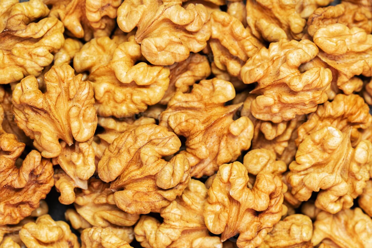 Walnuts background. Kernels walnuts. Top view. Vegetarian or healthy food photo