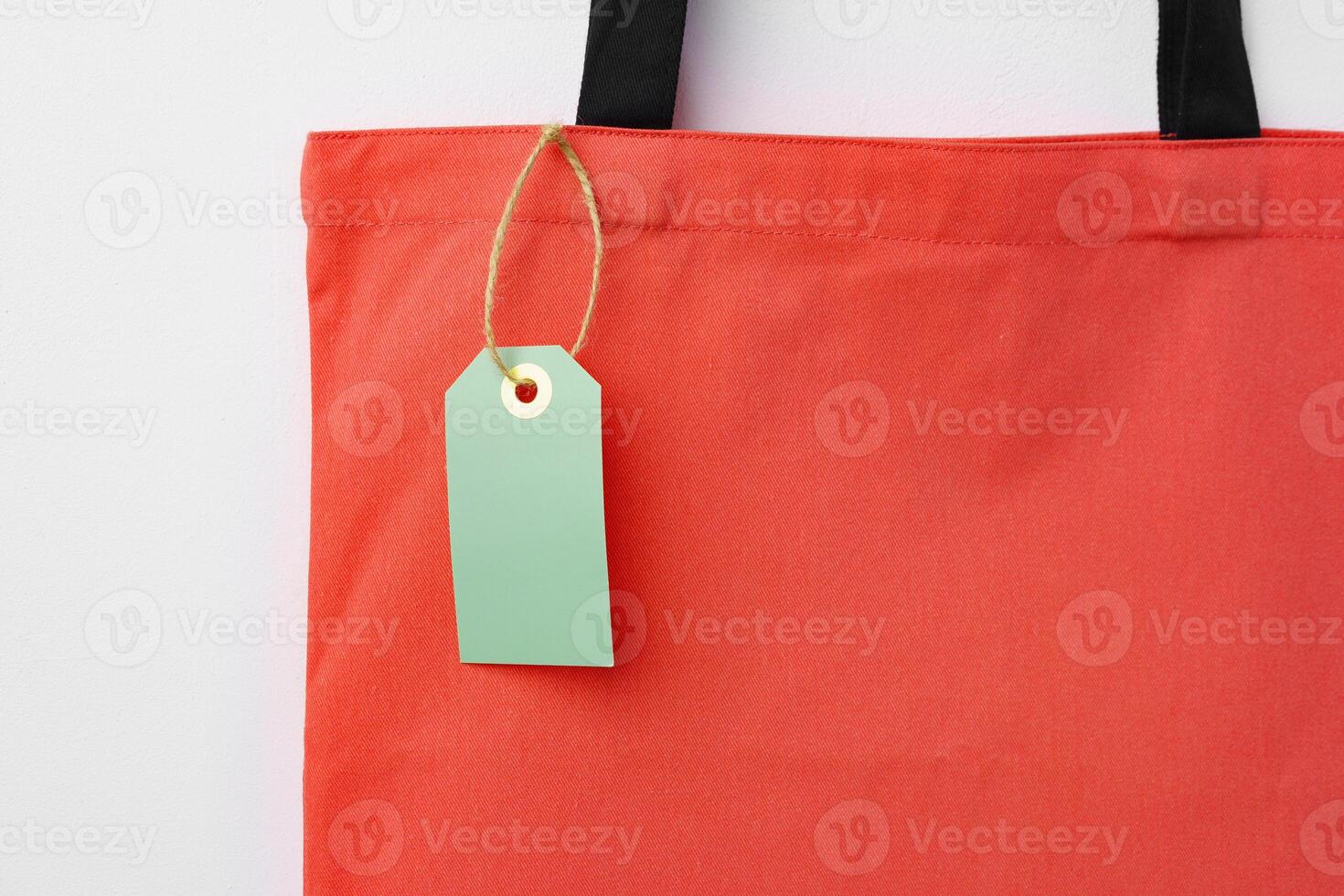 Eco bag for shopping with blank tag on white background photo