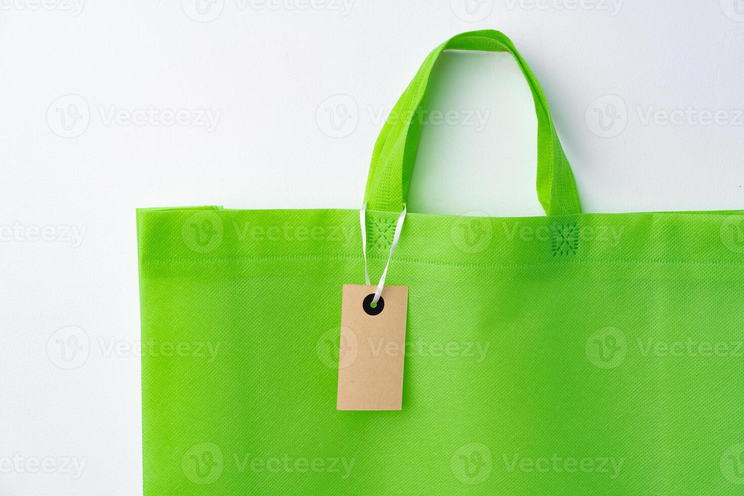 Eco bag for shopping with blank tag on white background photo