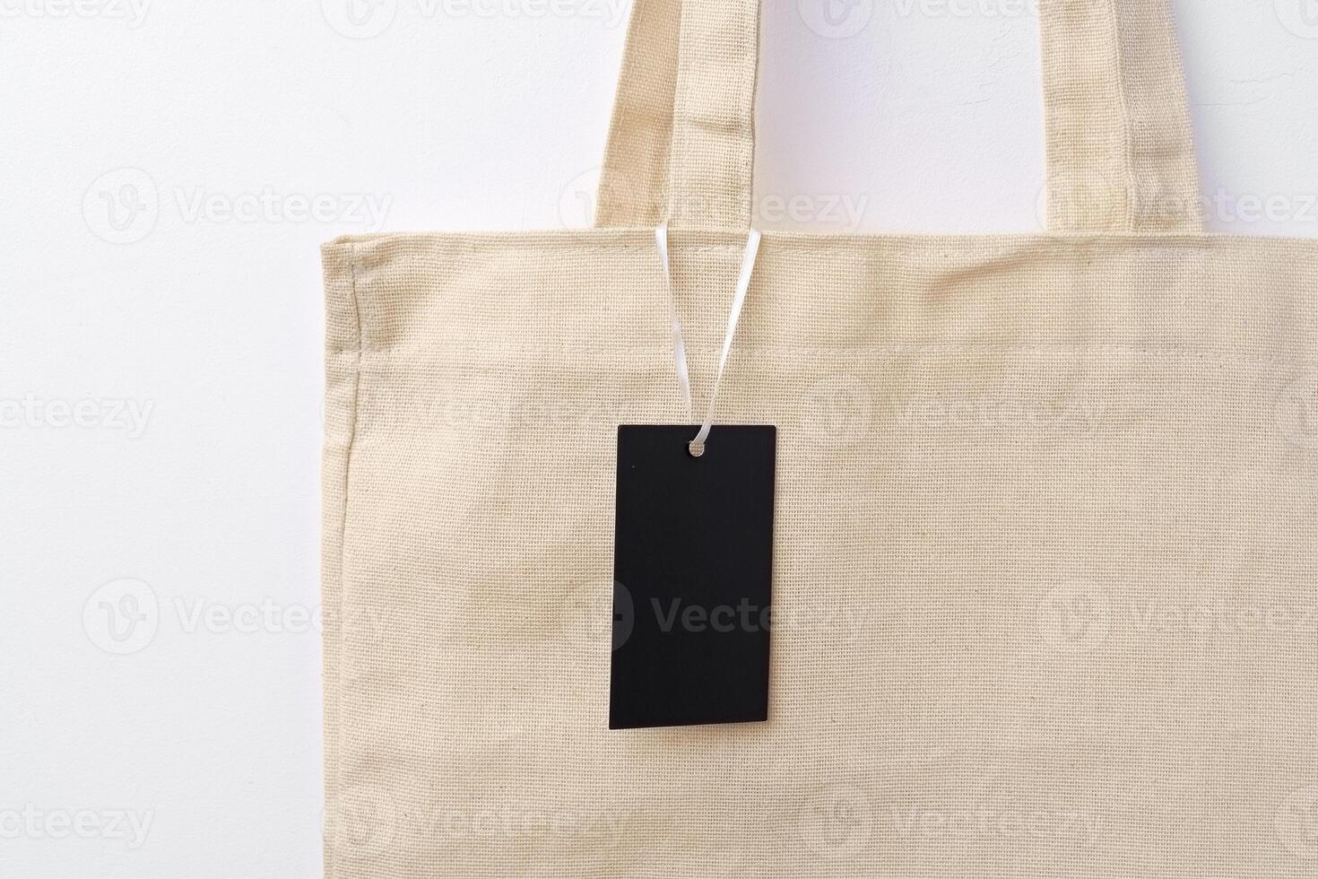 Eco bag for shopping with blank tag on white background photo