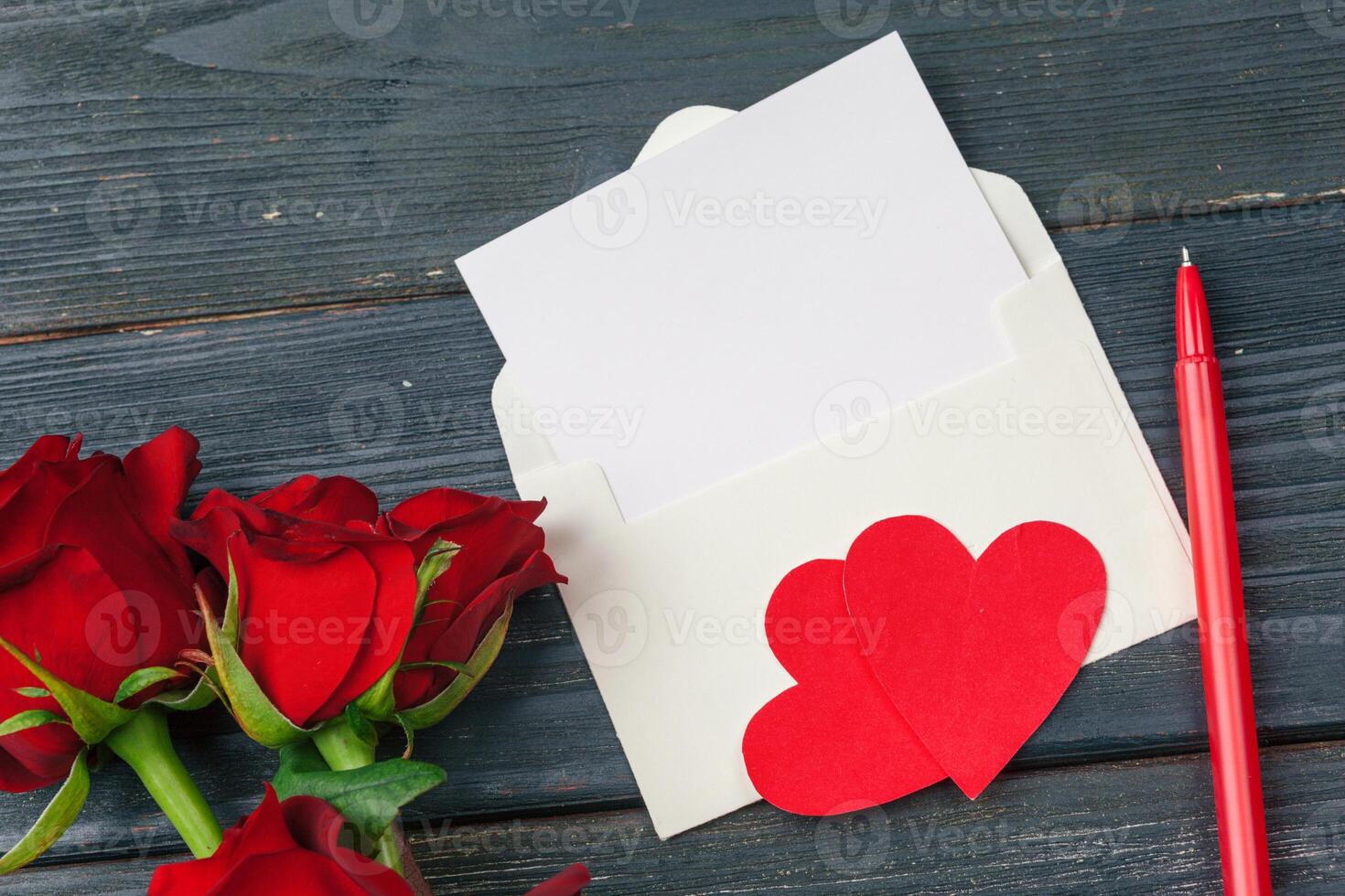 Red roses with message card. Valentines Day background photo