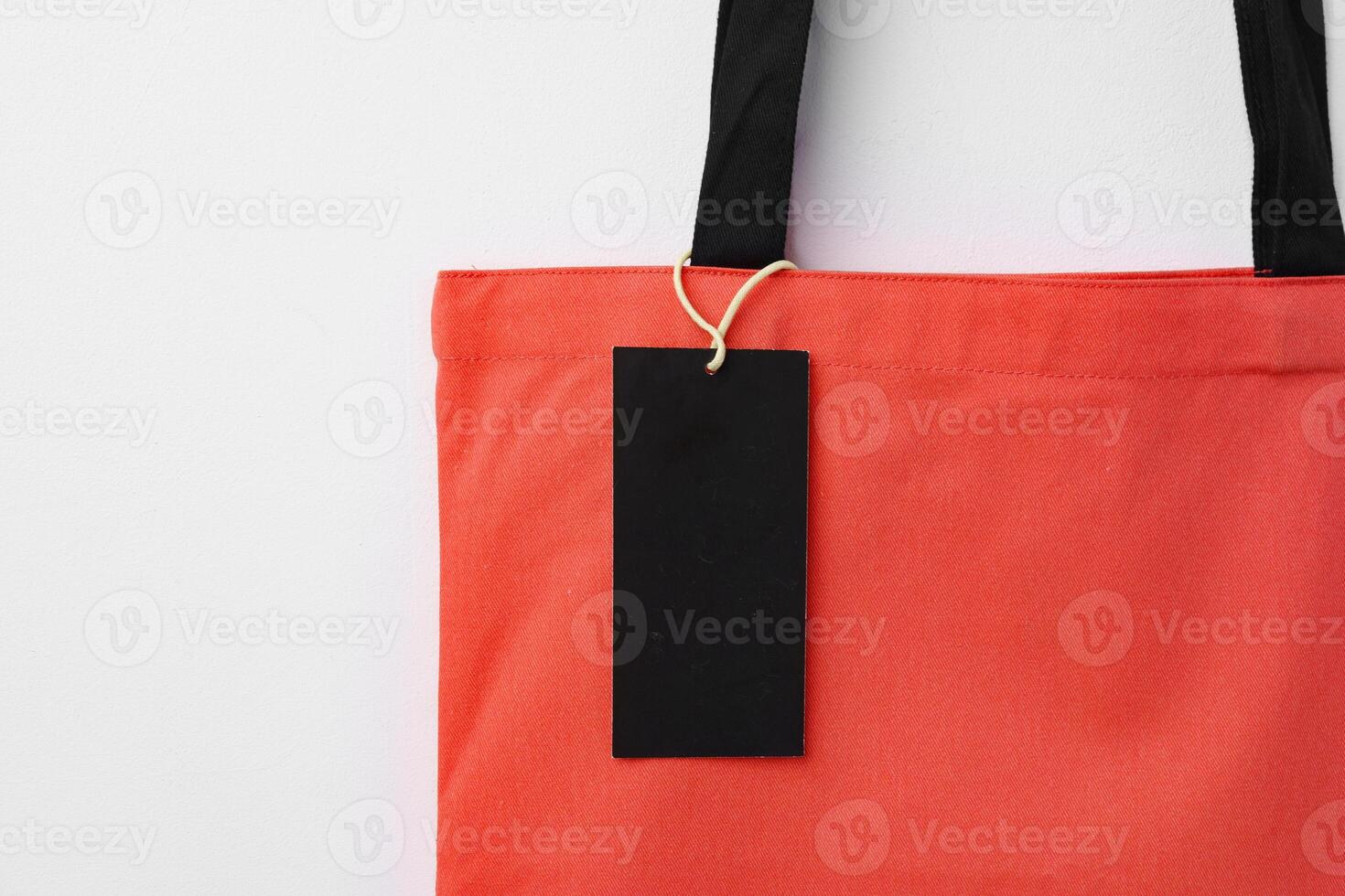 Eco bag for shopping with blank tag on white background photo