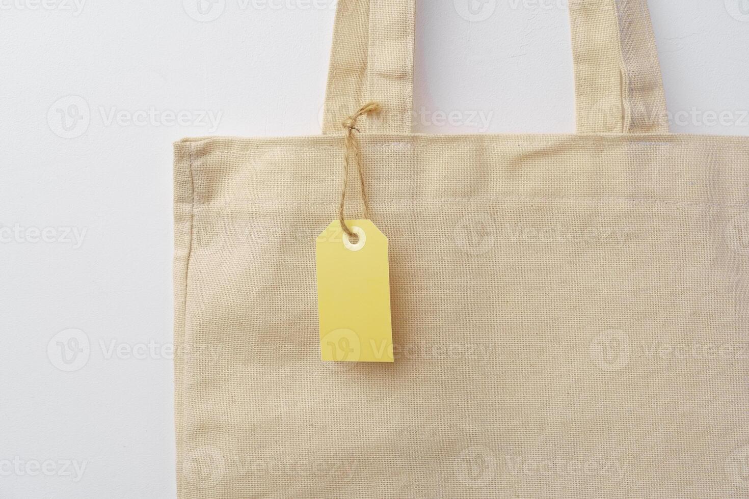 Eco bag for shopping with blank tag on white background photo