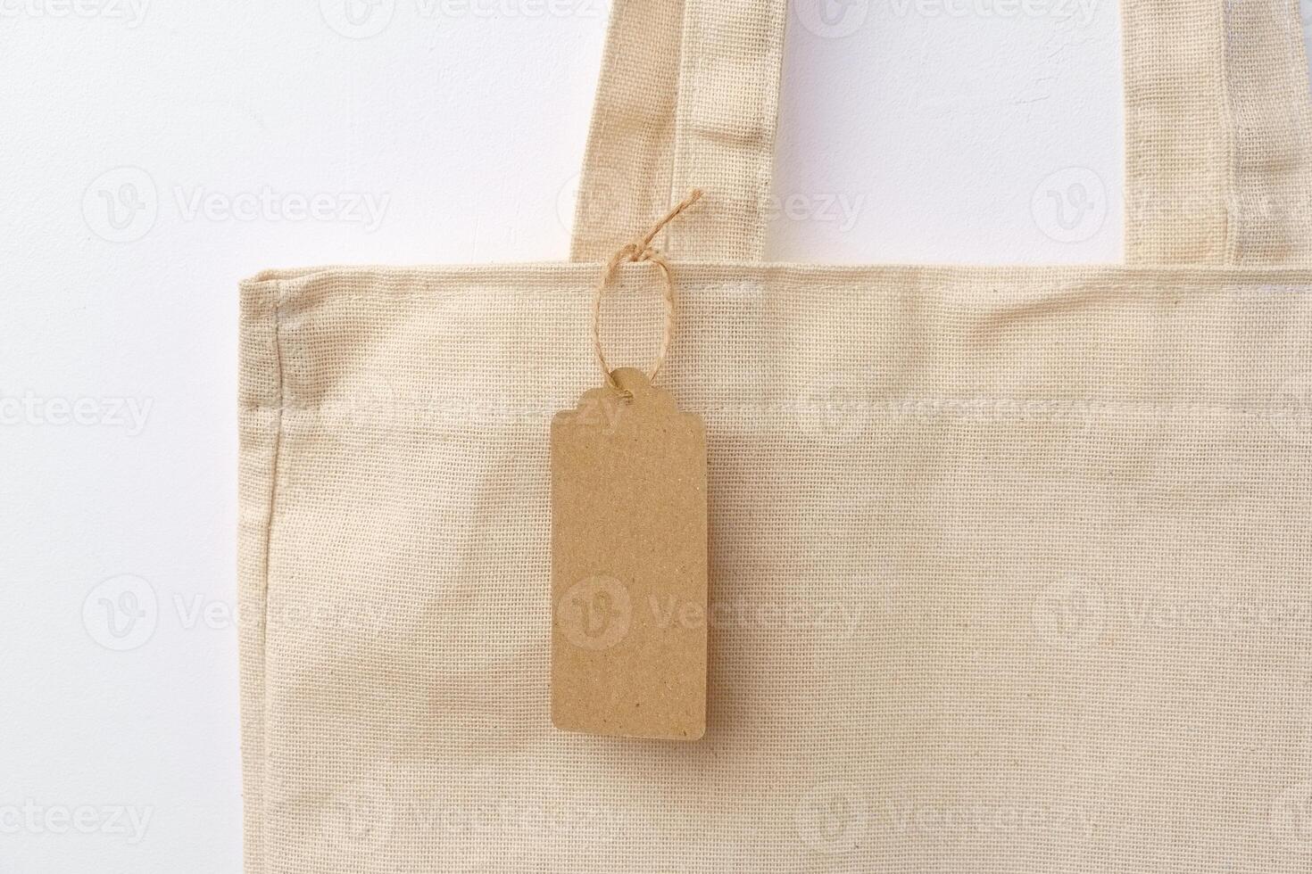 Eco bag for shopping with blank tag on white background photo