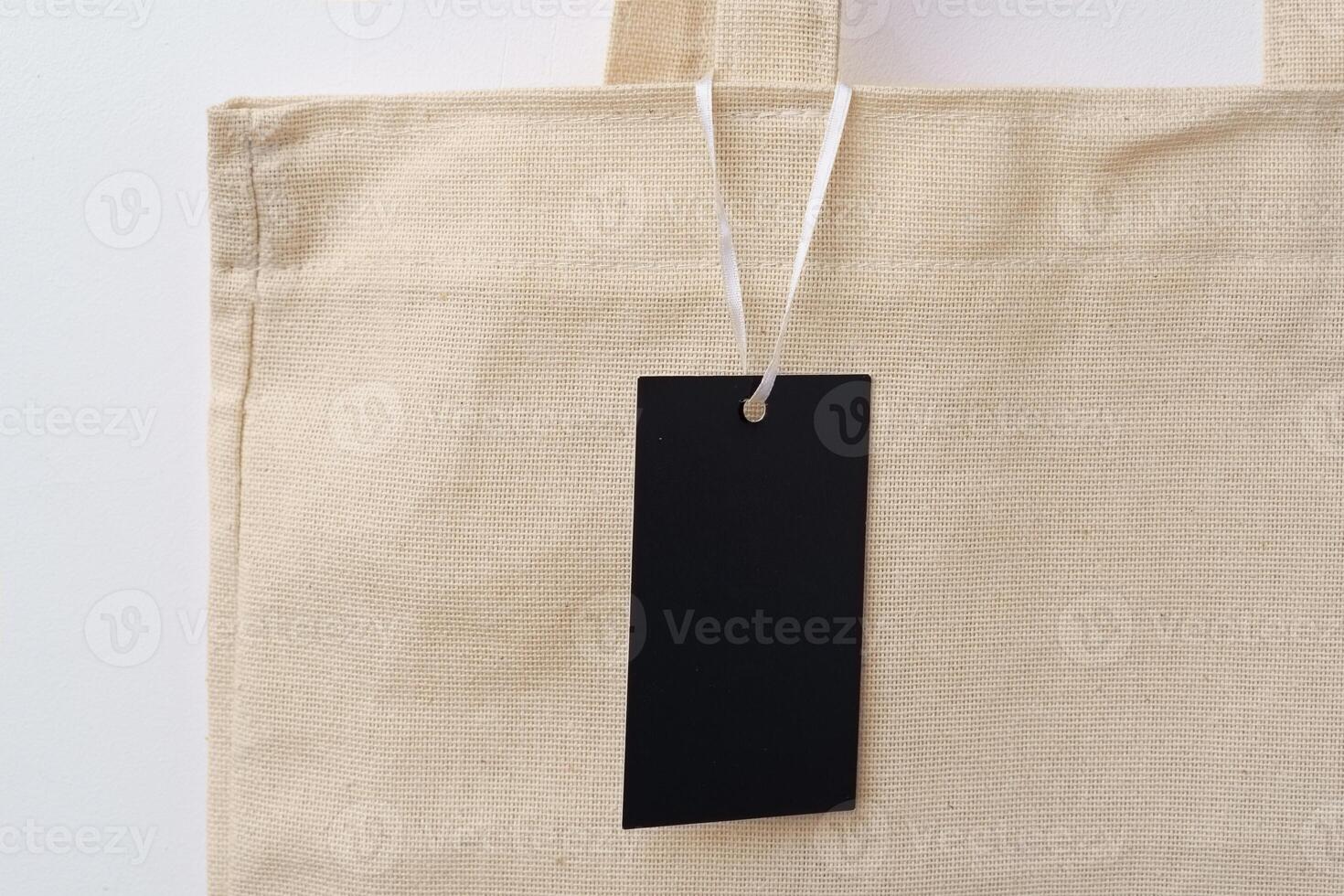 Eco bag for shopping with blank tag on white background photo