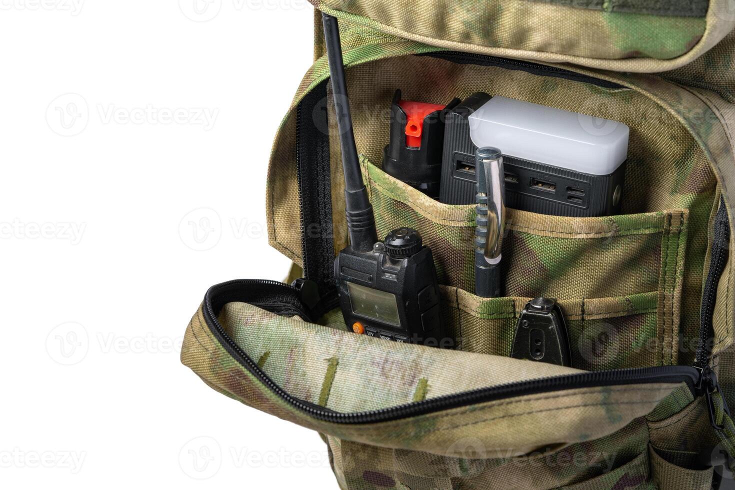 Open military backpack of khaki color on a white background photo