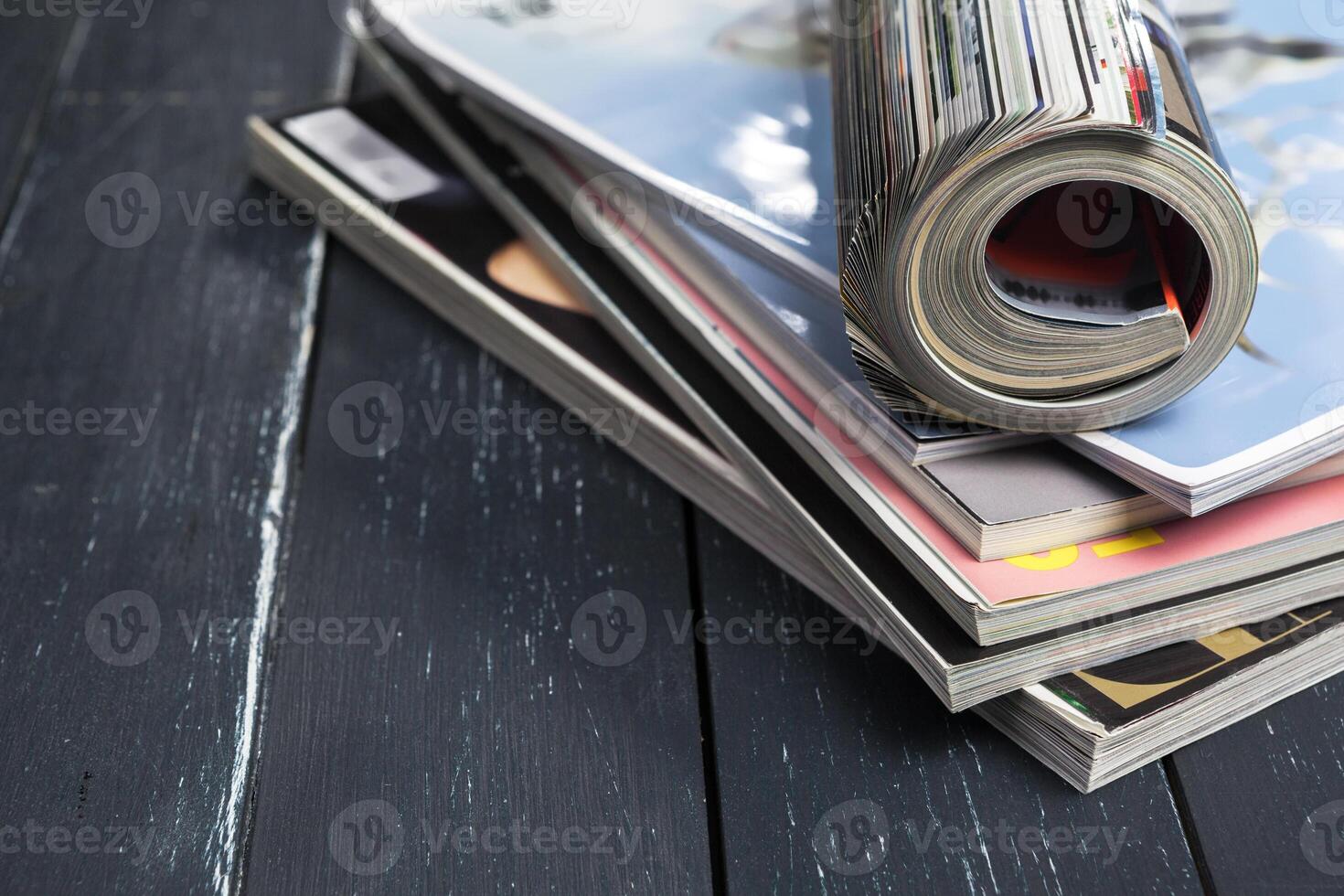 Close up stacking magazine place on table background photo