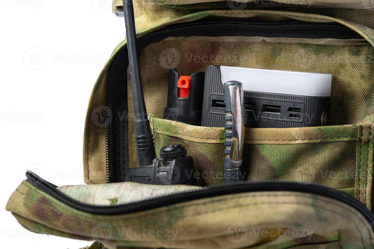 Open military backpack of khaki color on a white background photo