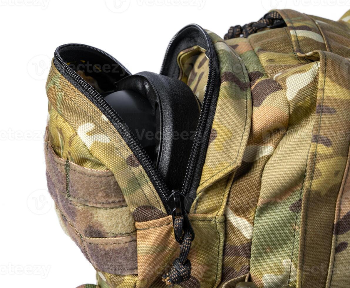 Open military backpack of khaki color on a white background photo