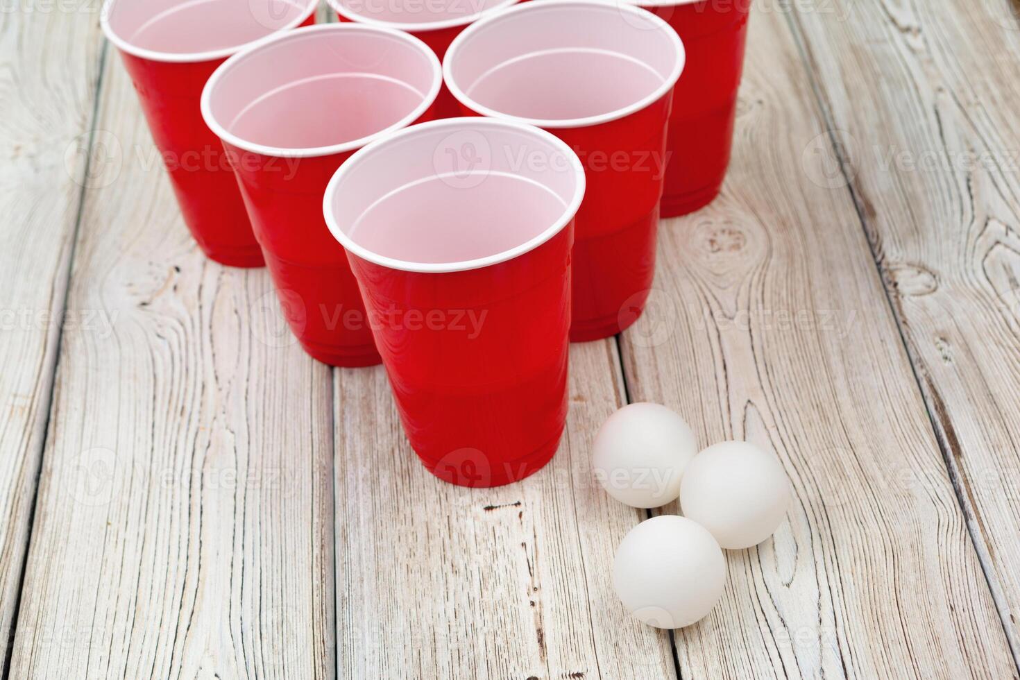 Cups for game Beer Pong on the table photo