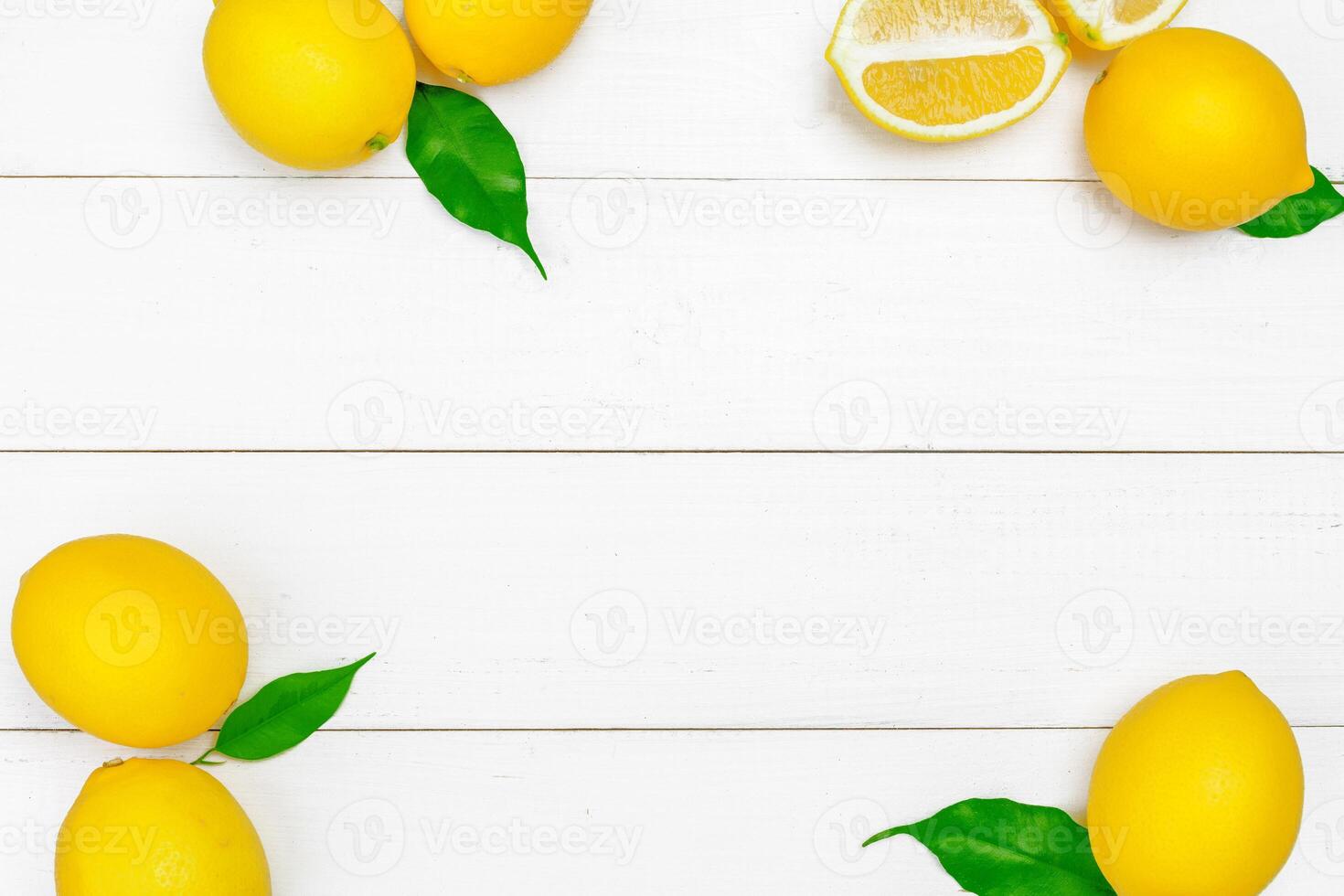 fresh lemons on wooden table. photo
