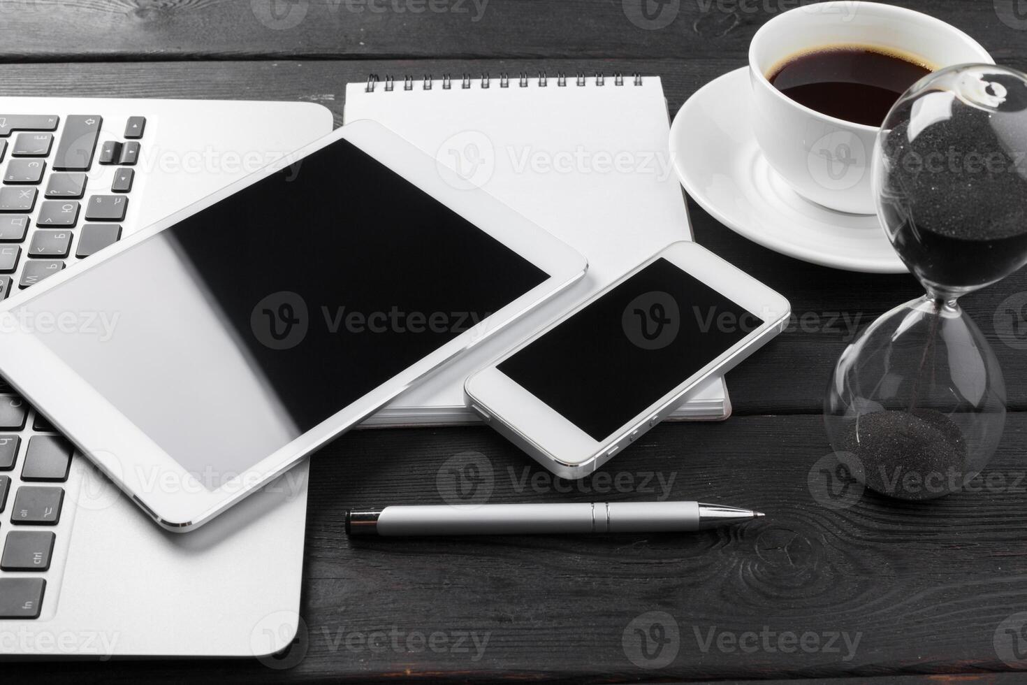 Open laptop with digital tablet and smartphone close up photo