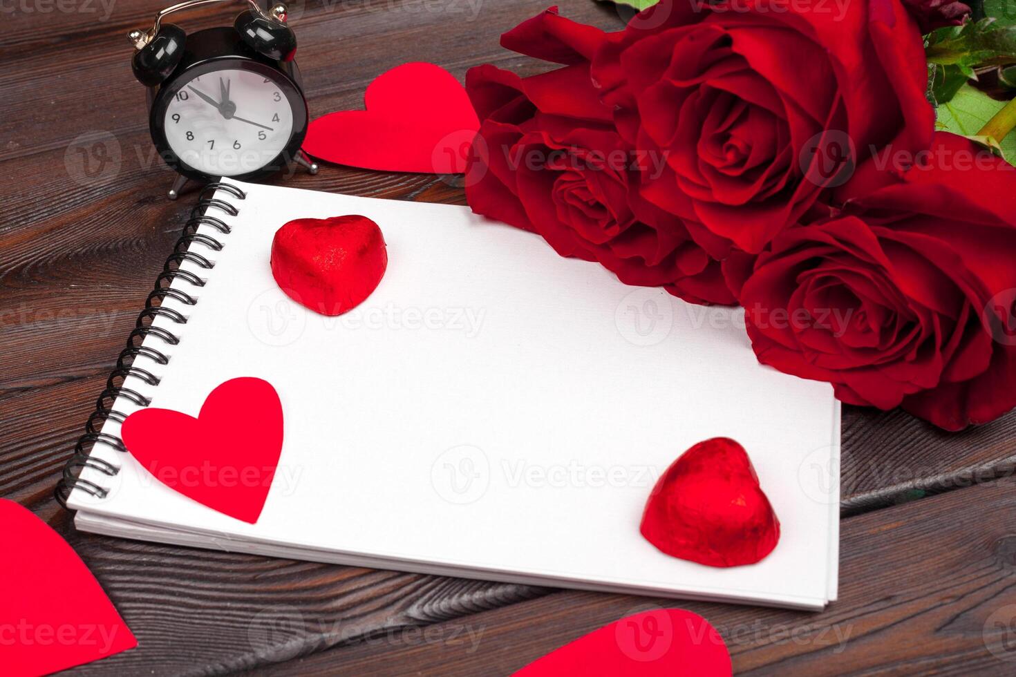 Valentine's day background. Empty blank notebook, gift box, flowers on a white background, top view. Free space for text photo