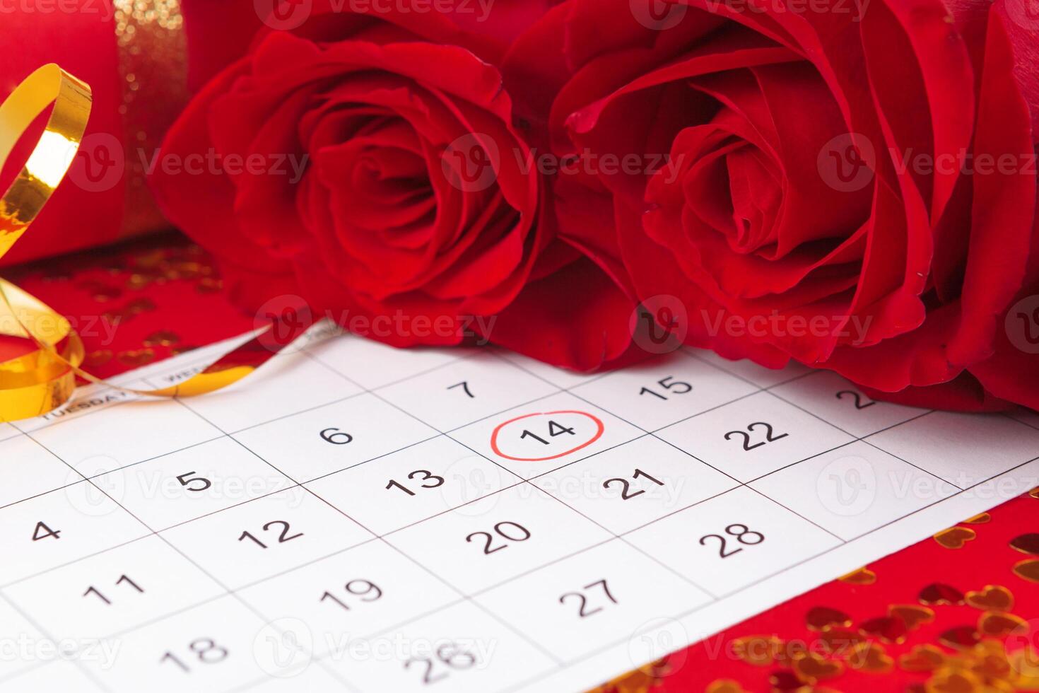 February 14 on calendar and decorations for Valentine's Day. photo