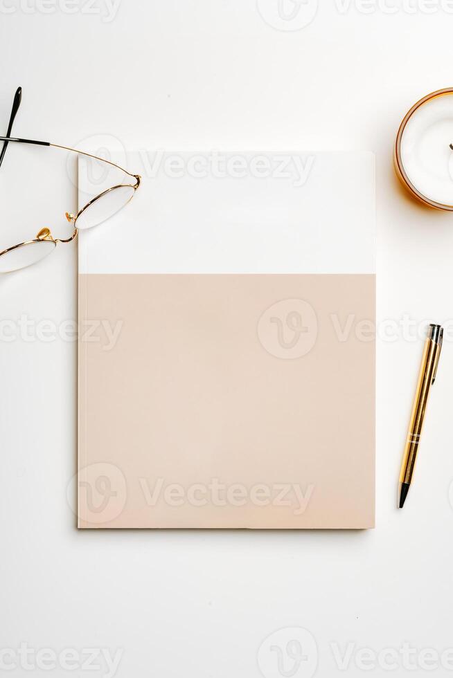 Glasses on the table with the stack of papers top view photo