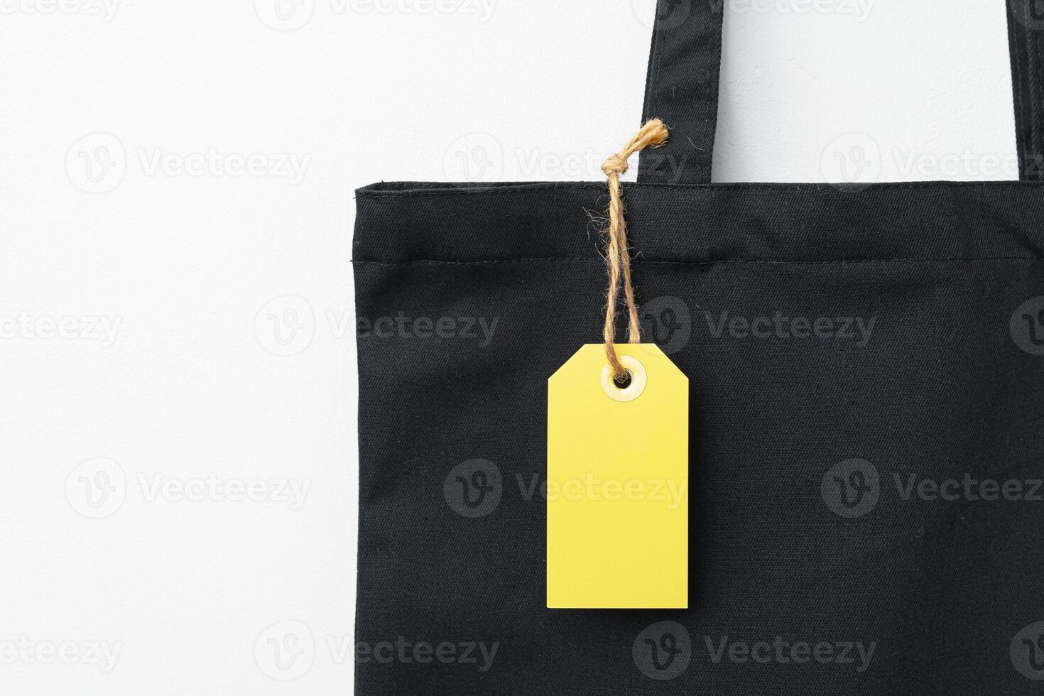Eco bag for shopping with blank tag on white background photo