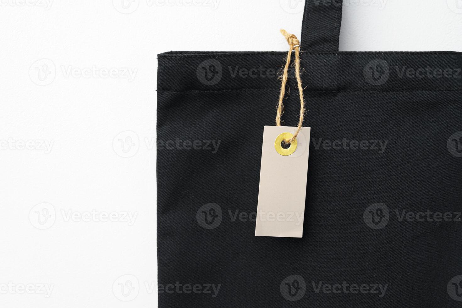 Eco bag for shopping with blank tag on white background photo
