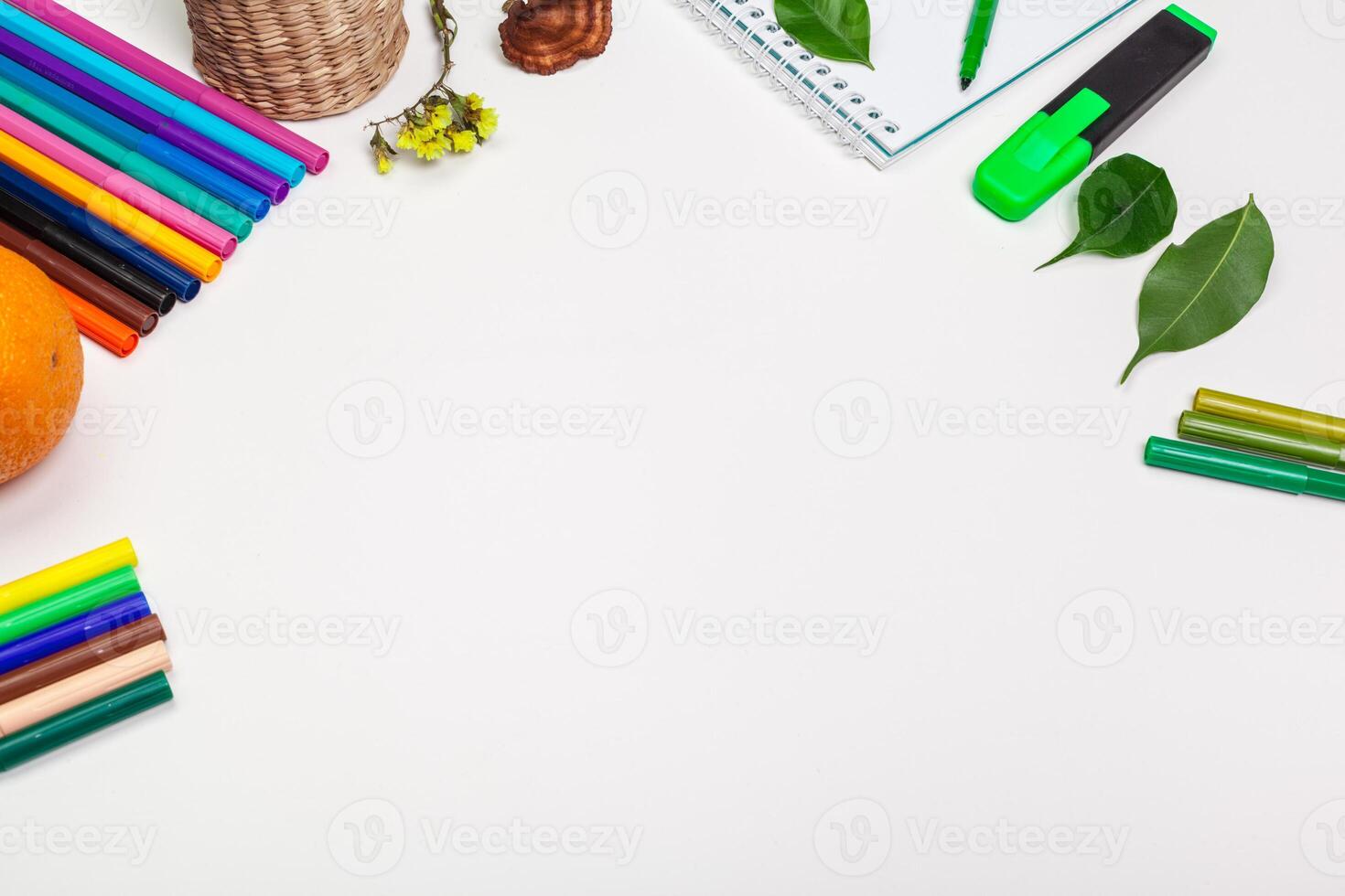 paper and colorful felt tip pens on the white table photo