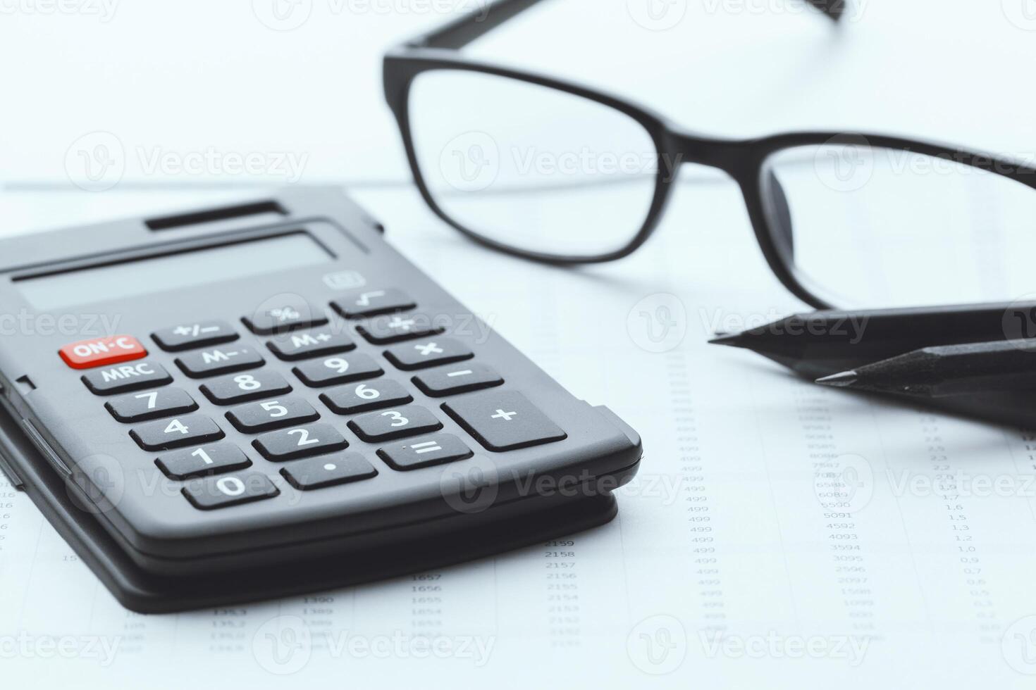 Business still life with calculator on table in office. photo