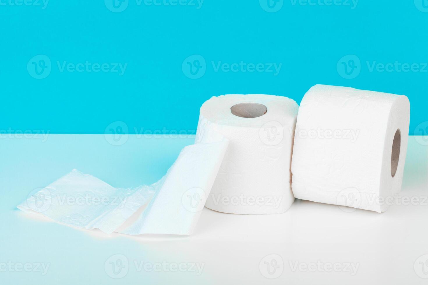 Roll of toilet paper or tissue on color background photo