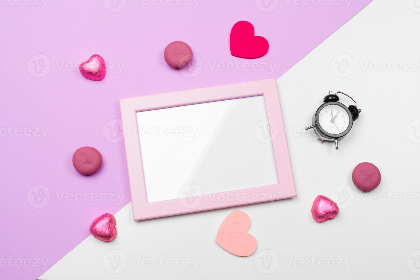 Valentines day photo frame or greeting card and handmaded hearts over table. Top view with copy space