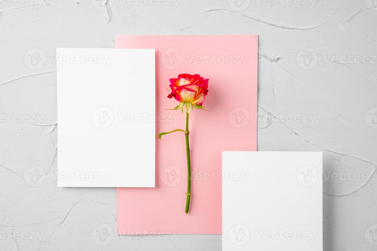 Top view of a pink paper letter and flowers with copy space photo