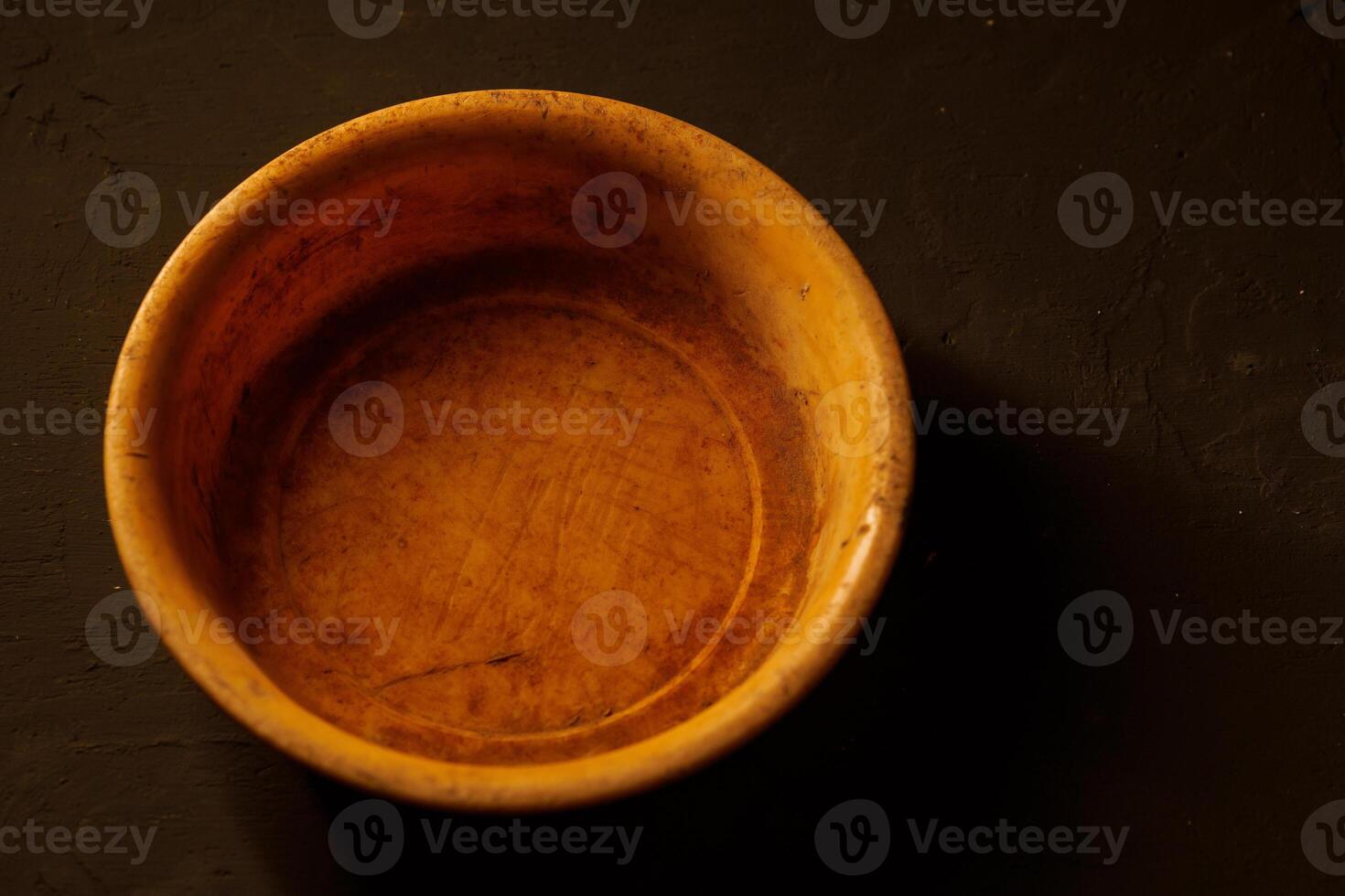 Empty bowl on dark background with copy space photo
