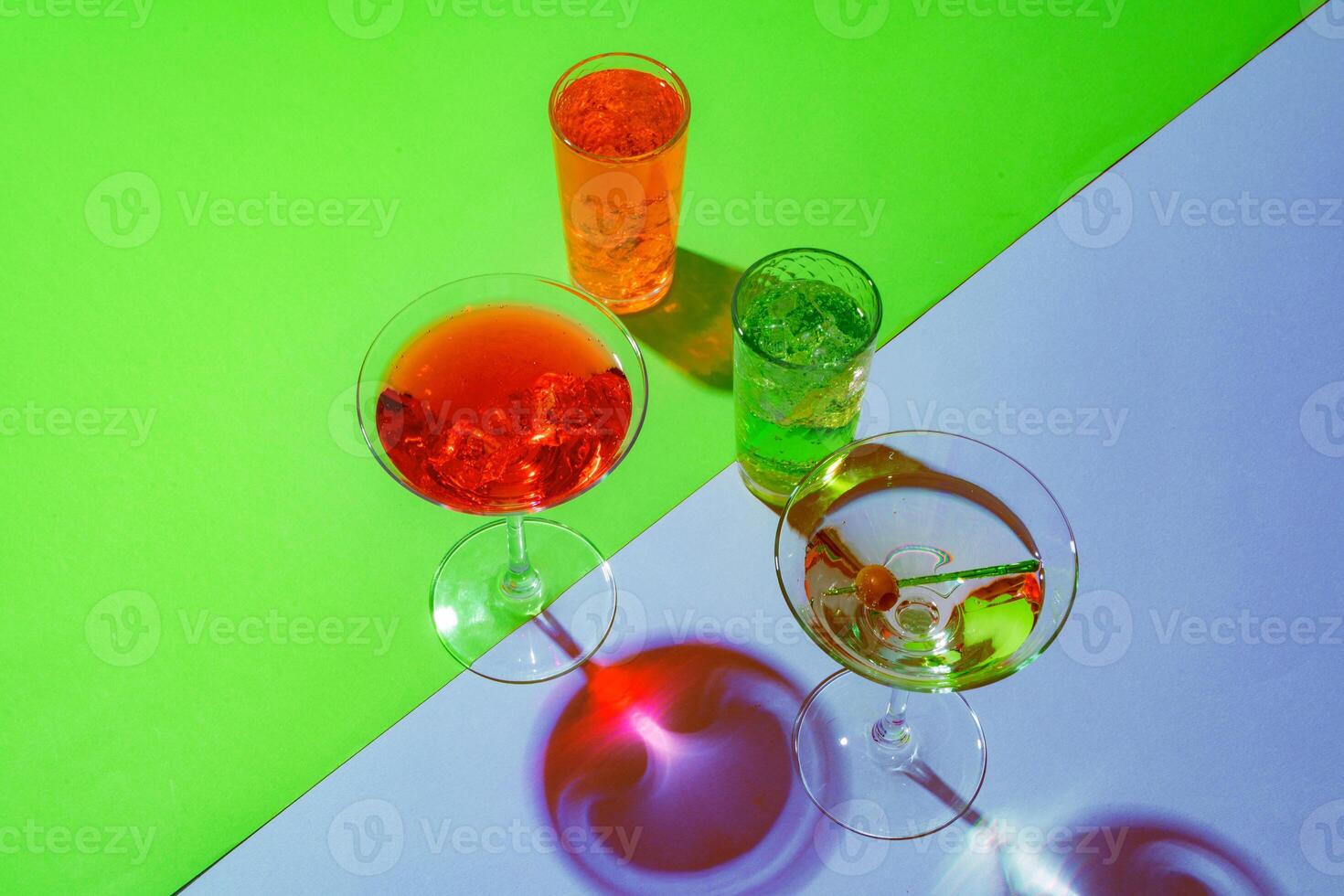 Cold and refreshing cocktails on color background photo