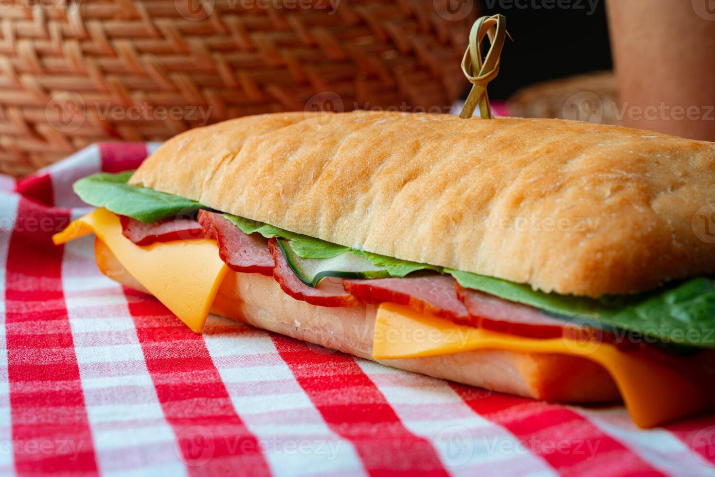Ham sandwich with cheese and lettuce on table photo