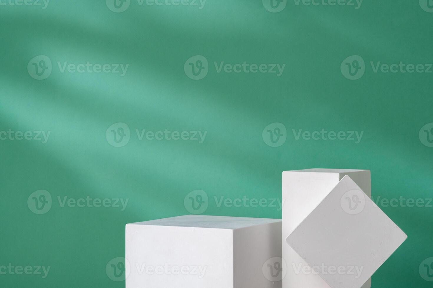 Simple geometric shapes on a green background with soft lighting photo