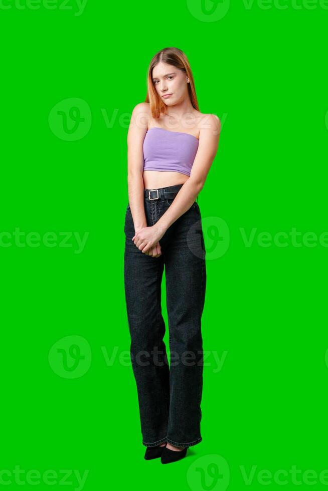 Young Woman With Long Hair Wearing Purple Top Looking Skeptical photo