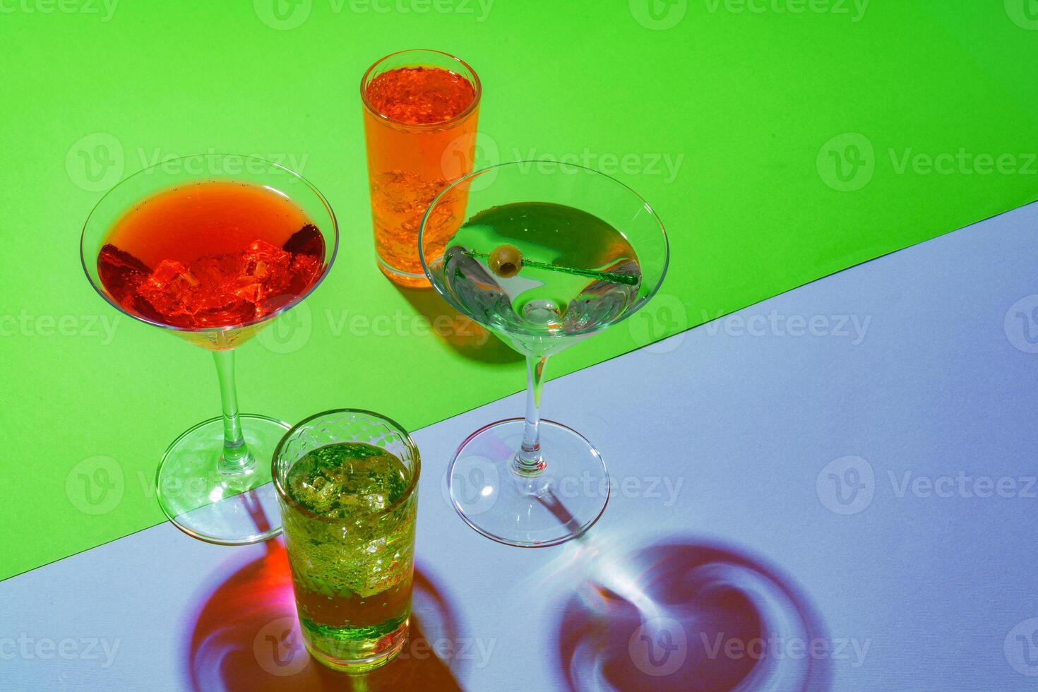 Cold and refreshing cocktails on color background photo