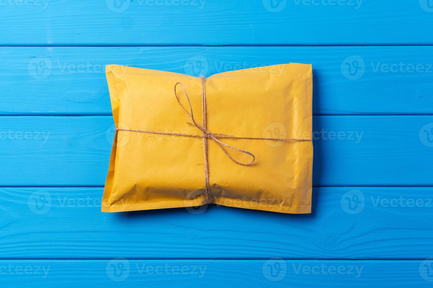 Lot of yellow paper postal envelopes. Top view. photo