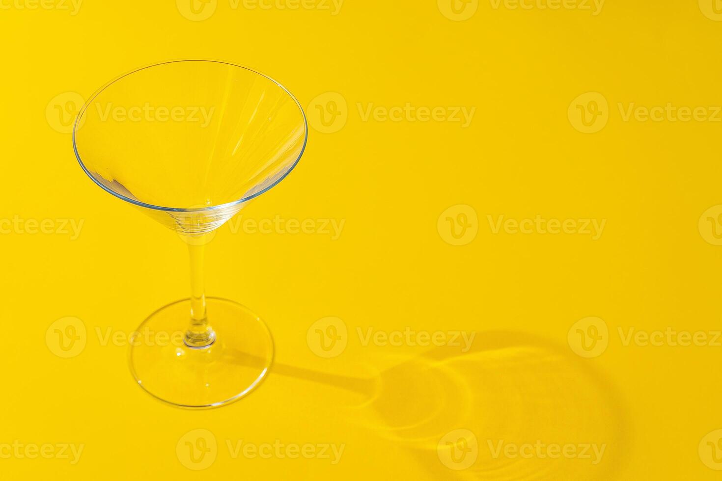 Empty transparent glass on a color background with copyspace. photo