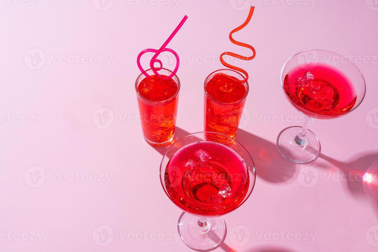 Pink summer cocktails on color background close up photo
