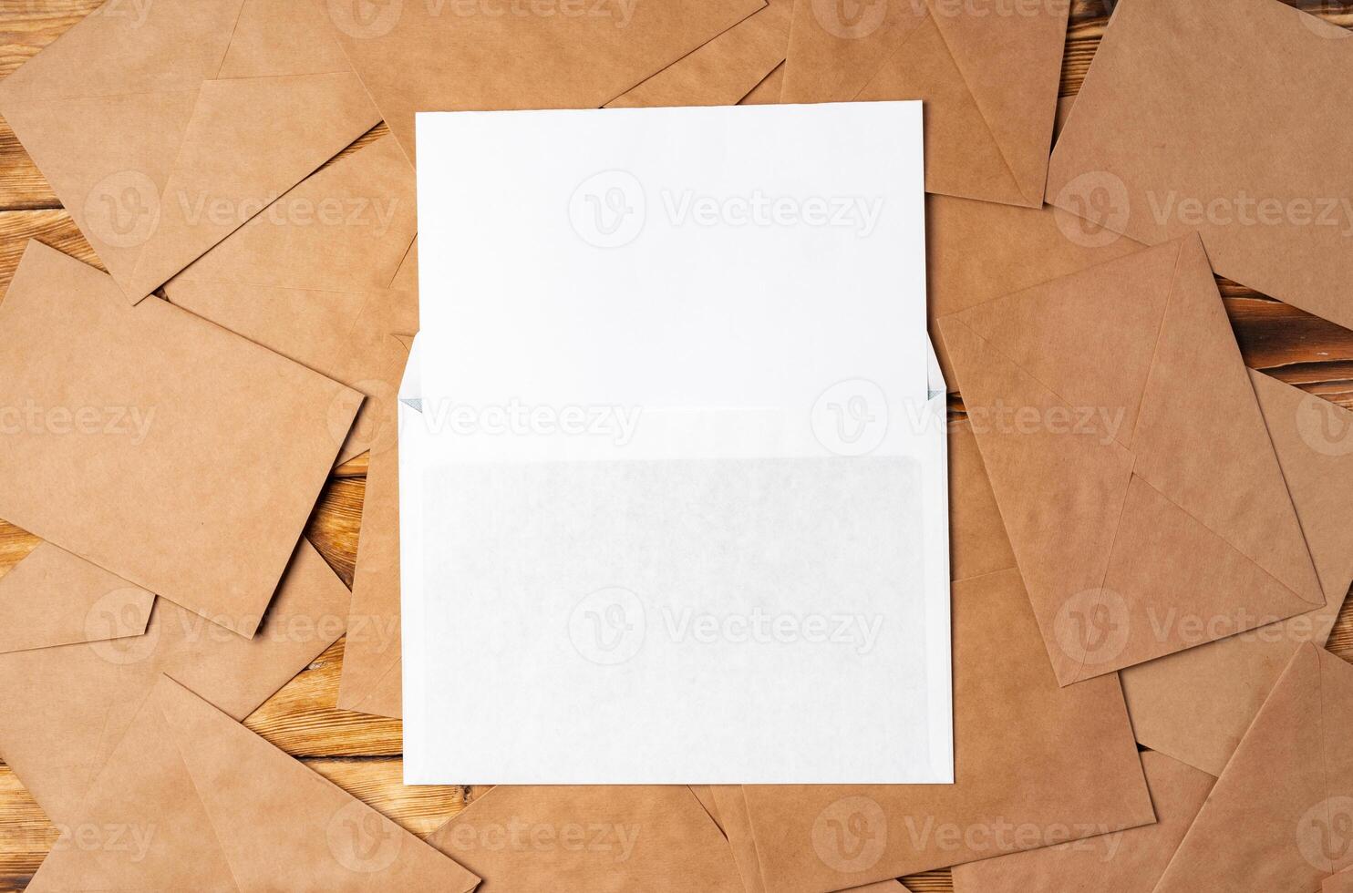 Stack of envelopes on working desk top view. Business mail photo