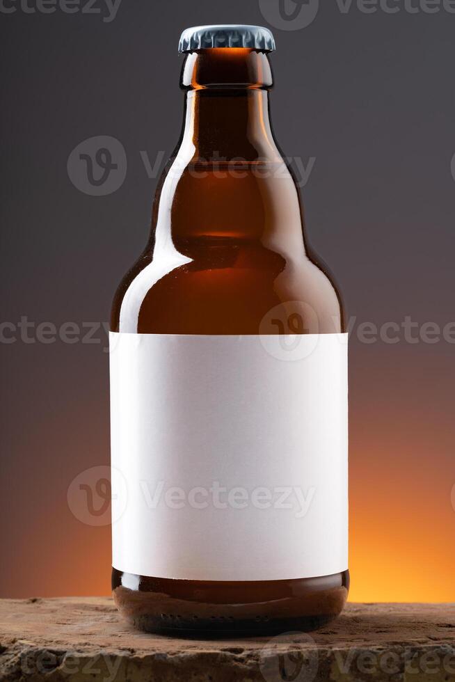 Blank label on the beer bottle on dark background. photo