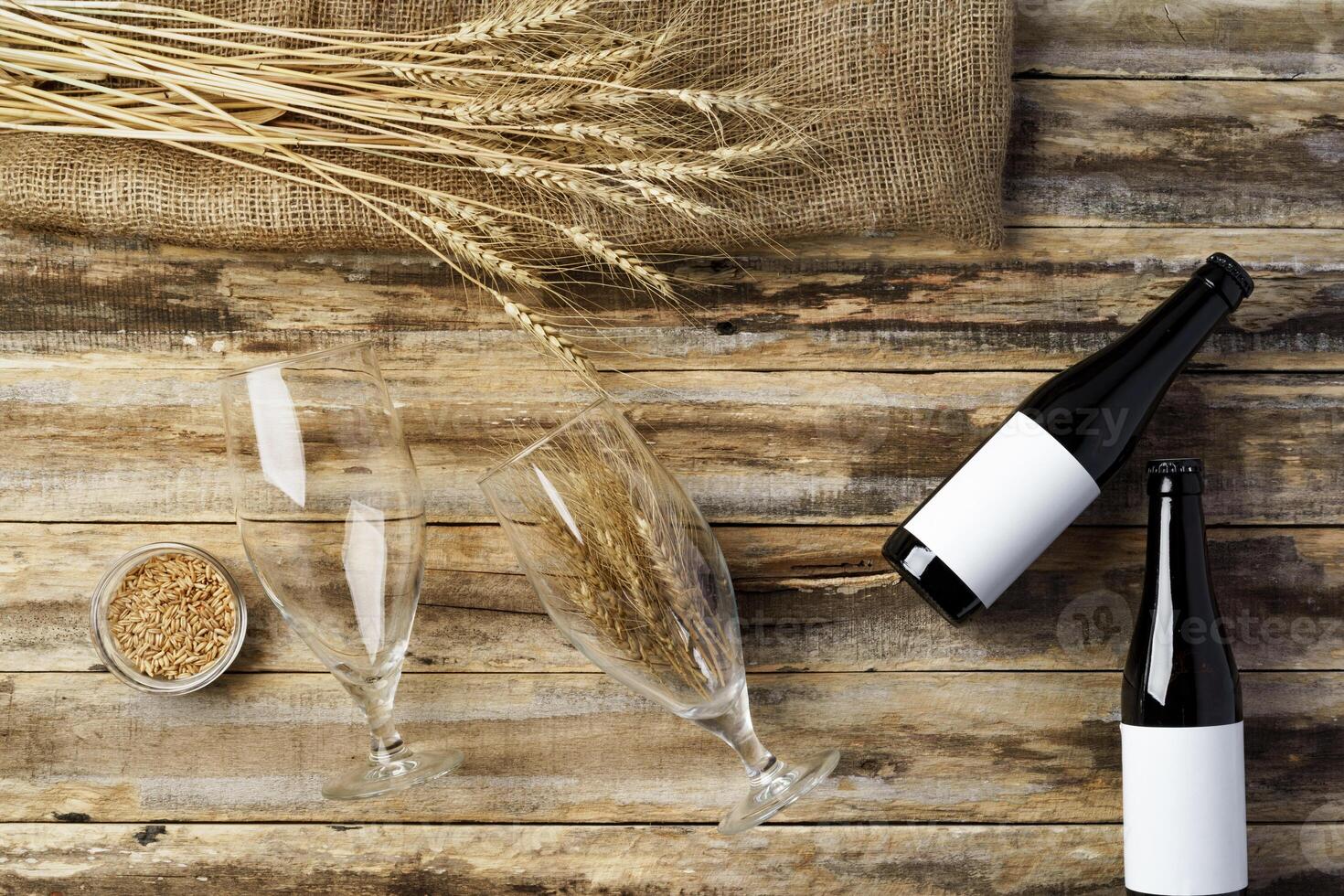 A bottle of beer and grain. Top view. Free space for text. photo