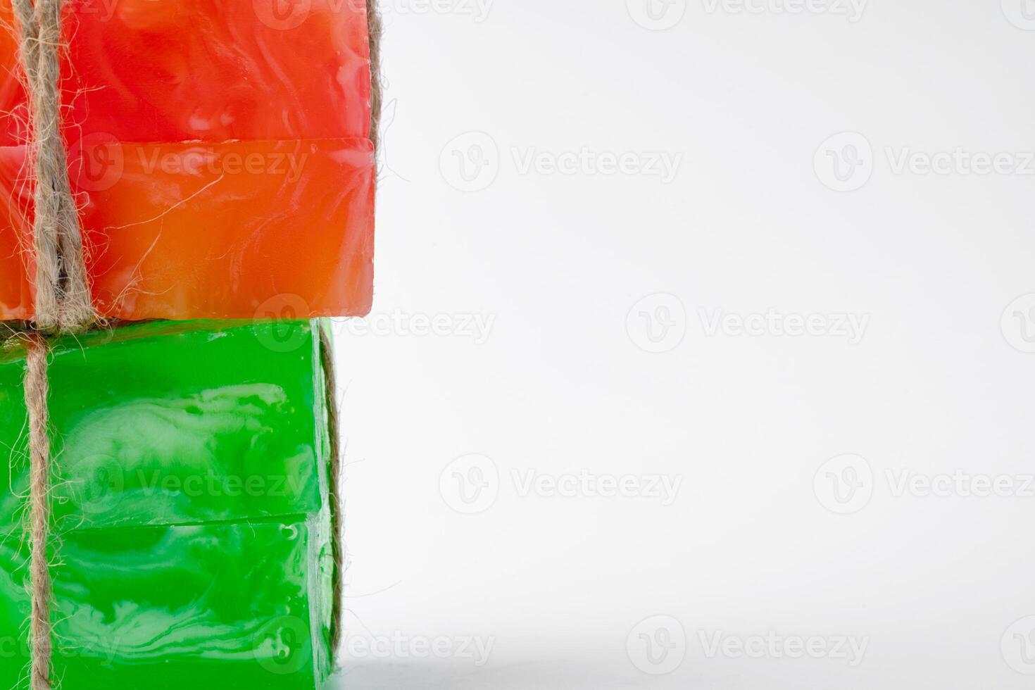 Green and orange handmade soap isolated on white backgorund photo