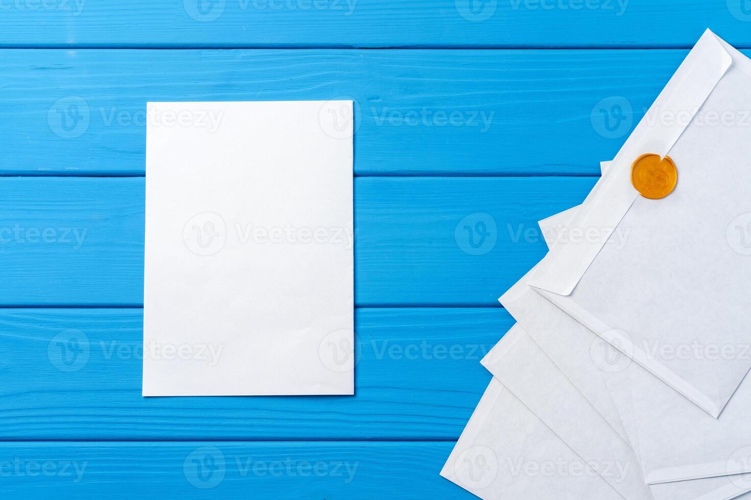 Stack of envelopes on working desk top view. Business mail photo